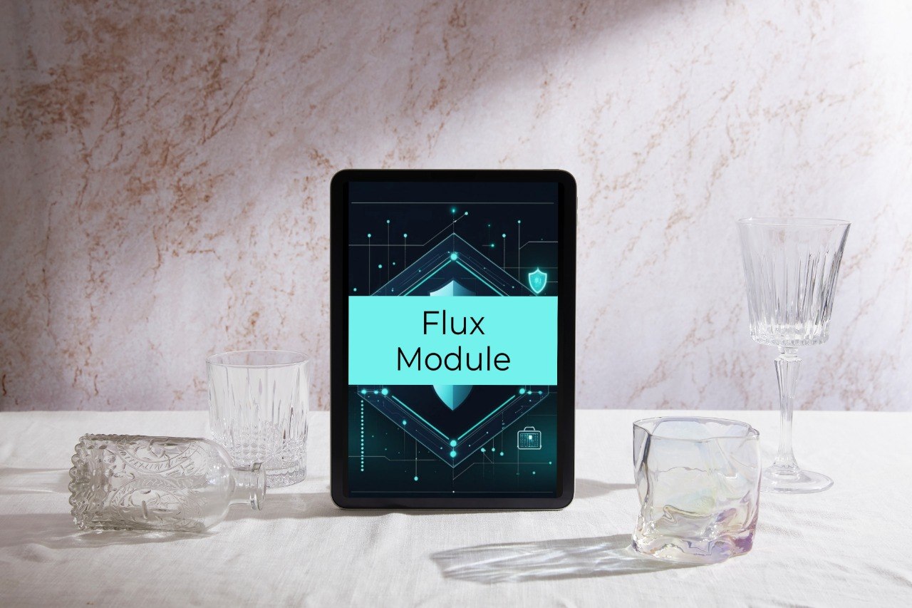 A tablet device displaying a bright cyan and black interface labeled 'Flux Module,' placed on a white draped surface with several clear drinking glasses and a glassware cup around it against a light textured wall.